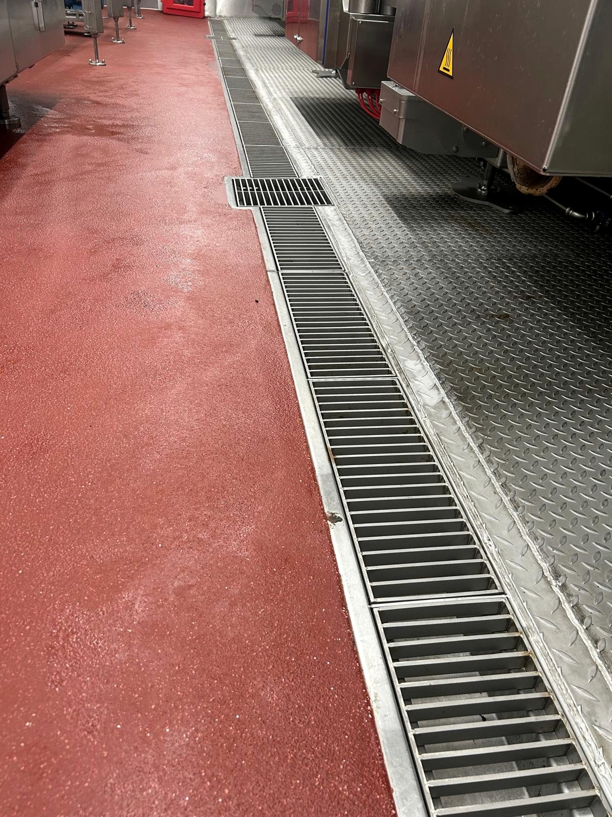 Finished drainage channel and stainless production floor detail